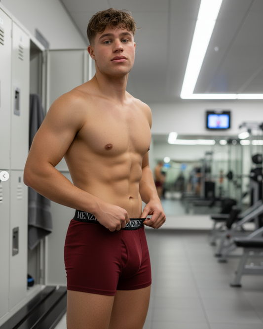 Man wearing red Menzies underwear in a locker room setting